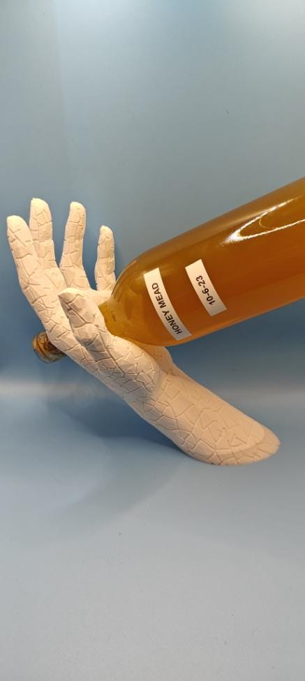 Hand Shaped Wine Bottle Holder: Modern Art Sculpture & Bar Decor
