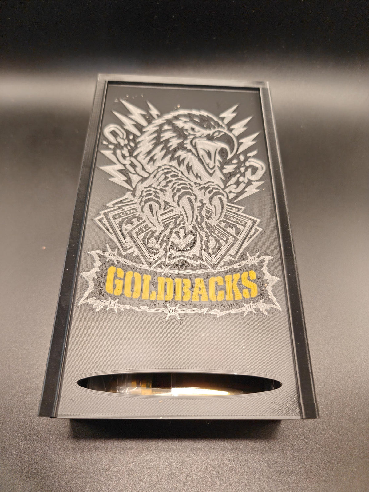 Goldbacks and money box